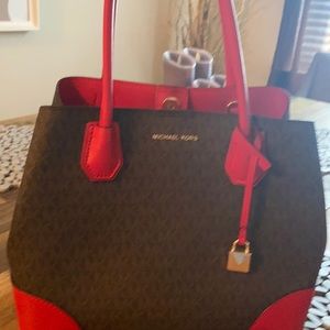 Michael Kors scarlet and brown purse.